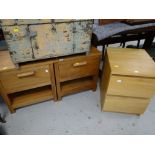 A pair of modern hardwood single drawer bedside cabinets together with an IKEA two-drawer cabinet