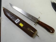 An Indian sheathed long blade knife