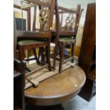 Late nineteenth century circular extending dining table with single column on heavily carved