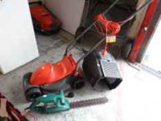 A Flymo rotary lawn mower together with a Qualcast hedge trimmer E/T