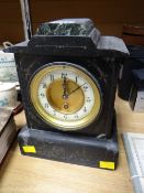 A vintage black slate clock