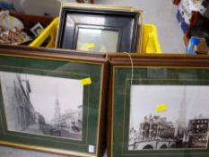 A crate of various framed prints