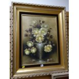 A gilt framed oil on board - still life of yellow roses, signed JEANETTE DYKMAN