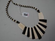 A black & white possibly African bone necklace
