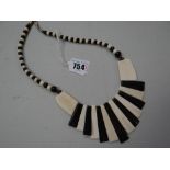 A black & white possibly African bone necklace