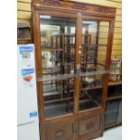 An Oriental hardwood glazed display & mirror backed cabinet with asymmetrical shelving, 196 x 102