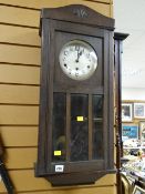 A vintage oak cased Vienna-style wall clock