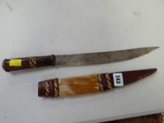 An African animal skin decorated long knife