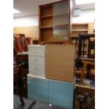 A parcel of furniture to include small sliding glass door bookcase, white chest of drawers,