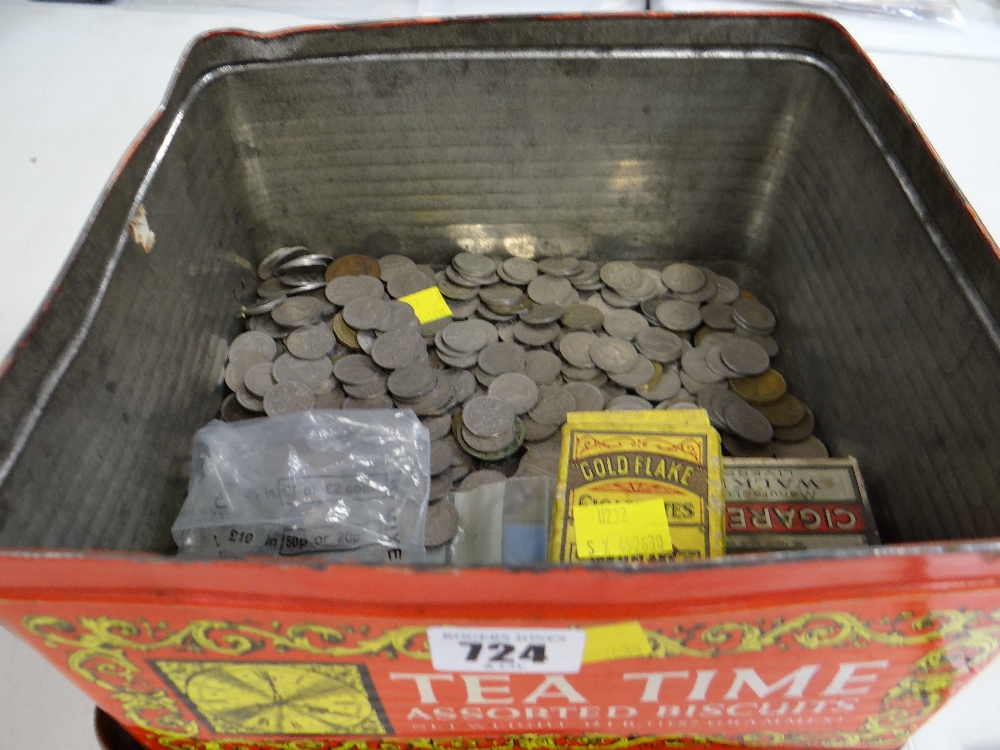 A biscuit tin containing a large quantity of pre-decimal coinage (mainly sixpence's) together with