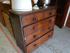 An early twentieth century oak chest of drawers, two short above three long, 104 x 106 x 51cms