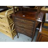 A reproduction stained pine four-drawer music cabinet, 76 x 57 x 36cms