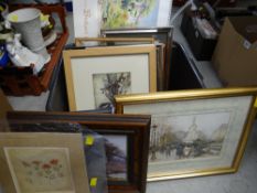 A box of various framed prints