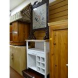 A small pine top kitchen storage unit together with a vintage carved firescreen