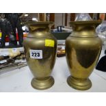 A pair of polished brass Hong Kong made etched decorated vases