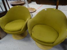 A pair of retro revolving Danish designed armchairs