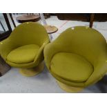 A pair of retro revolving Danish designed armchairs