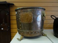 A copper & brass footed lion-handled log bin
