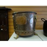 A copper & brass footed lion-handled log bin