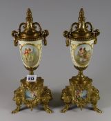 Pair of reproduction gilt metal clock garnitures (clock missing)