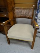 A low rattan back armchair