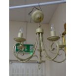 A modern painted metal five-branch ceiling light