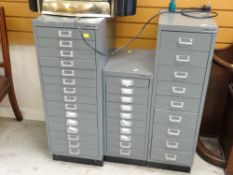 Three Bisley grey metal multi-drawer filing cabinets