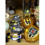 Collection of Formula One racing cars, military wall shields etc