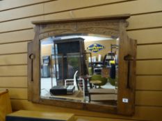 An Arts & Crafts-style bevel wall mirror