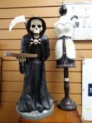 Small decorative mannequin together with a grim reaper figure