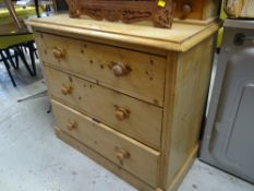 A pine three-drawer chest of drawers