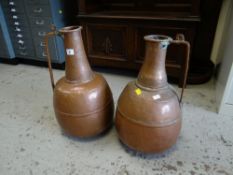 A pair of beaten copper water vessels