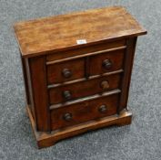 A miniature chest of two-long & two-short drawers