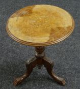 A walnut & inlaid top carved footed table