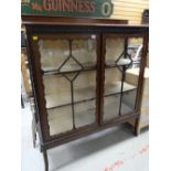 A nice Edwardian mahogany railback display cabinet on raised feet