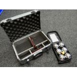 A metal camera carry case & boule set