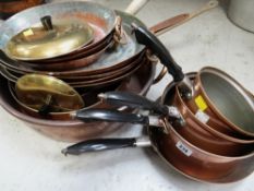 Collection of various copper cooking utensils