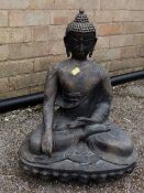 A cast metal Buddha figure (outside)