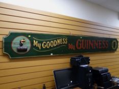 A vintage painted wooden Guinness advertising sign 'My Goodness, My Guinness', 300 x 39cms
