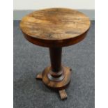 An antique rosewood circular top & tri-footed occasional table