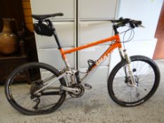 A Giant Anthem X1 mountain bike with foot pump