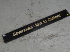 A vintage railway destination sign for 'Sevenoaks: fast to Catford'