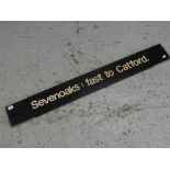 A vintage railway destination sign for 'Sevenoaks: fast to Catford'