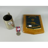 A WWII medal, EPNS tankard & military wall plaque