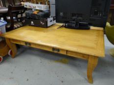 A large lightwood coffee table with geometric patterned top & centre drawer, 145 x 98cms