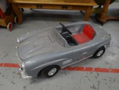 A Mercedes child's toy pedal car