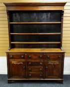 AN UNUSUAL MIXED WOOD WELSH DRESSER closed base of flanking cupboards with single drawer above and