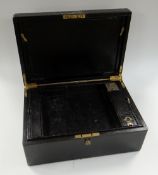 A VICTORIAN BLACK MORROCCO LEATHER WRITING BOX with brass mounts, the interior with two layers and
