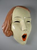 A CZECHOSLOVAKIA POTTERY 'SCREAM' MASK with terracotta coloured hair, impressed Czech mark and