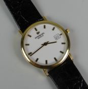 A GENT'S RAYMOND WEIL GOLD PLATED WRISTWATCH with wallet and papers, the dial of circular white form